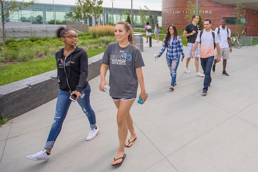 students walking outside university hall